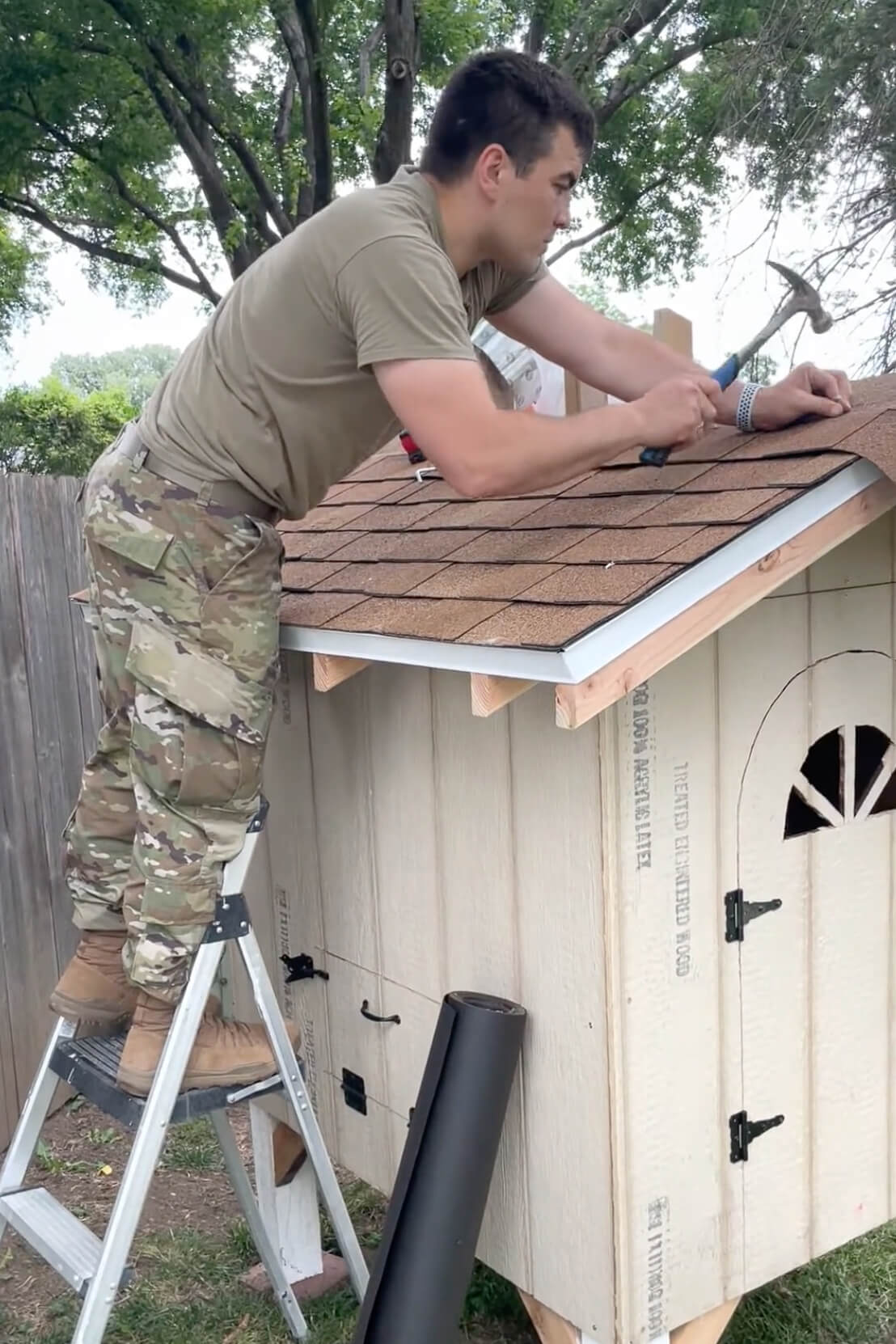 Adding roofing to our backyard chicken coop.